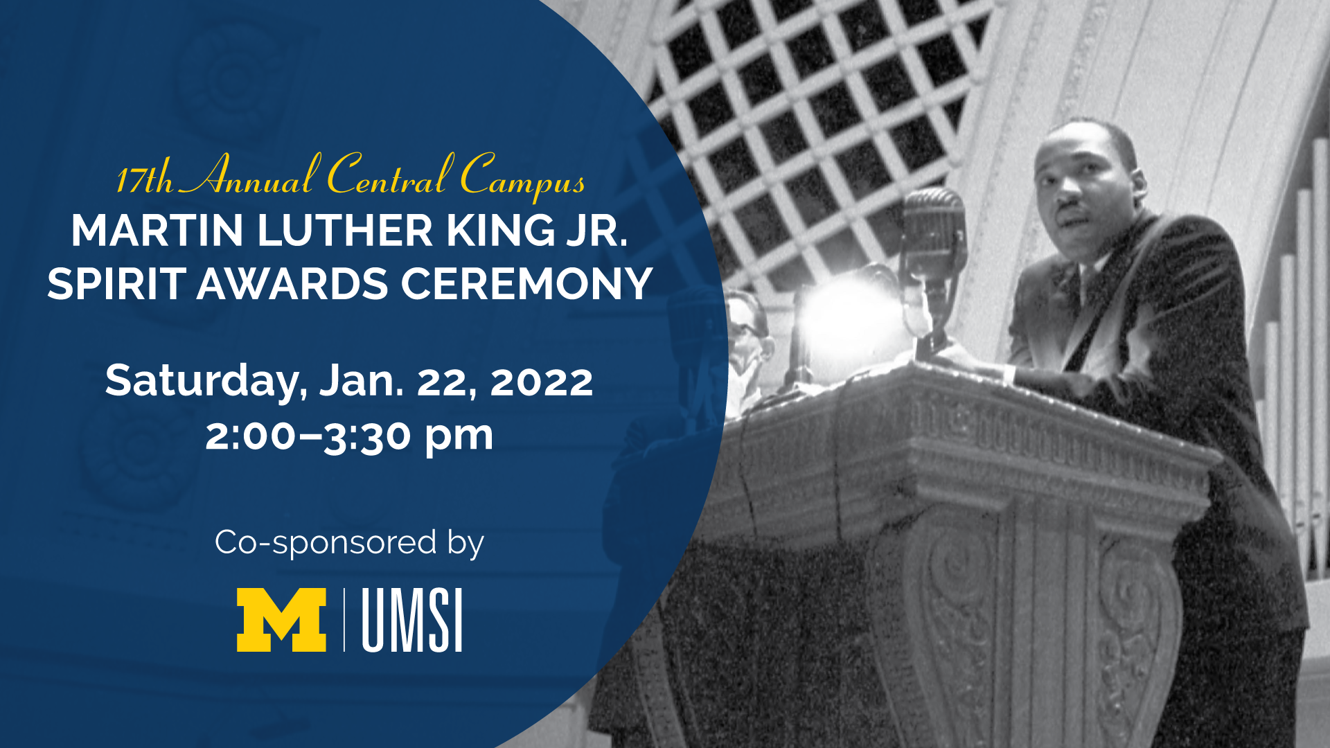 Monochrome image of Rev. Dr. Martin Luther King Jr. standing behind a podium with a microphone indoors. “17th Annual Central Campus Martin Luther King Jr. Spirit Awards Ceremony. Saturday, Jan. 22, 2022. 2-3:30 p.m. Co-sponsored by UMSI.”