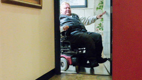 An man in a wheelchair in a doorway