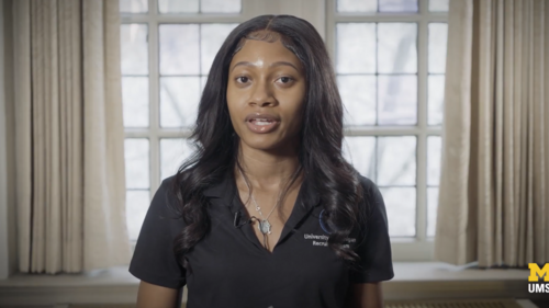 Screenshot of UMSI alum and Procter & Gamble recruiter Nia Gray speaking in front of a window. 