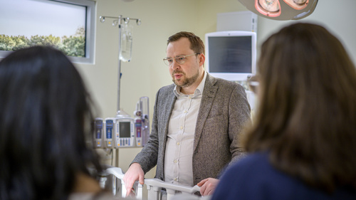 Assistant Professor Vitaly Popov talks with students in SI 582 Interaction Design at the University of Michigan Medical School Clinical Simulation Lab