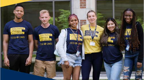 Six students posing together. They are wearing shirts that say "Information changes everything"