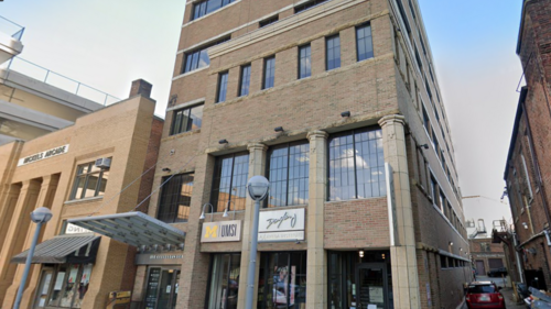 The front of 333 Maynard St. showing a sign for UMSI.