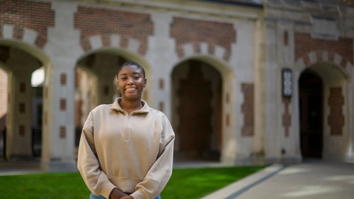 A photo of Tyra Briscoe standing in front of North Quad