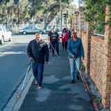 a group using canes to walk