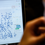 A person looking at a data visualization on a computer screen