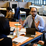 Students discussing together at a table