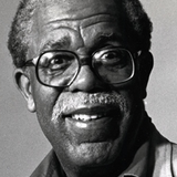 A black and white headshot of Dudley Randall