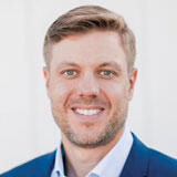 A headshot of Nick Benson