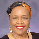 A headshot of Lou Devine Sanders