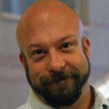 A headshot of Cory Knobel