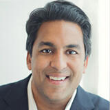 A headshot of Atul Rustgi