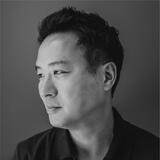A black and white headshot of Ben Sun