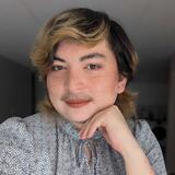 A headshot of Hibby Thach
