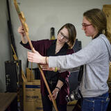 Two people work with materials in the basement of Saline city hall