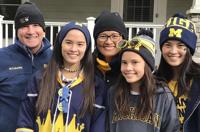 A family of five decked out in University of Michigan gear.