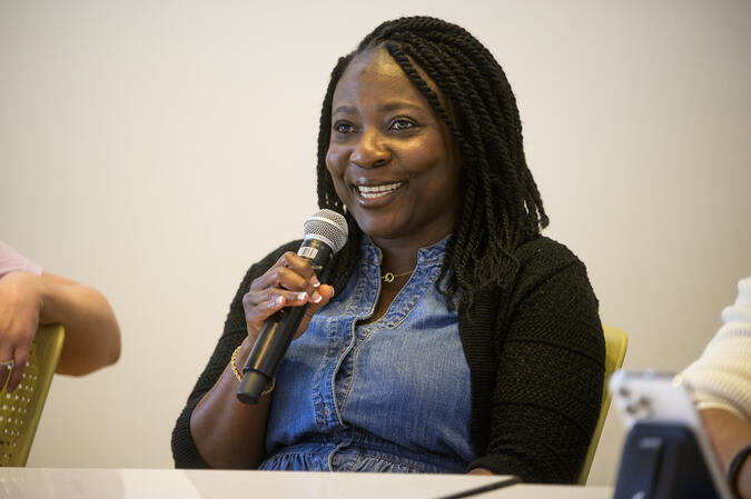 Olga Hamilton holding a microphone 