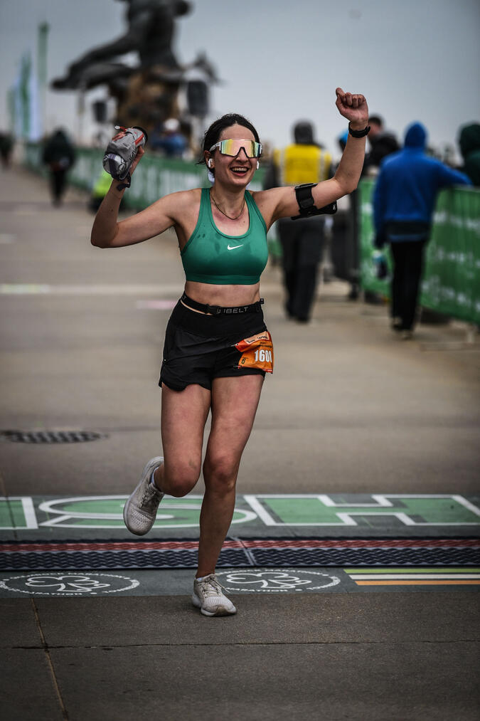 Ilana Gershenson crossing the finish line of a race