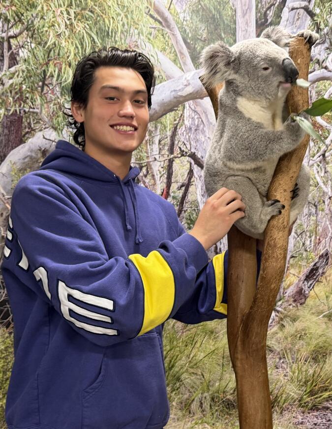 Julian Liao with a sleepy koala bear