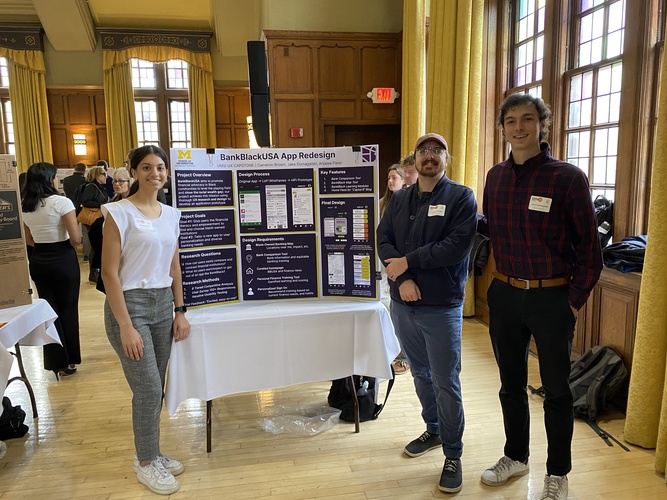 UMSI students Anjalee Patel, Cameron Brown and Jacob Domagalski pose with the poster board for their project at the 2023 UMSI Student Project Exposition. The project board is titled “BankBlackUSA App Redesign.” 