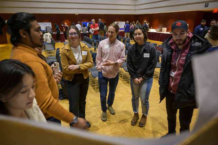 people gather in an event space