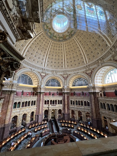 A photo of the main reading room of the Library of Congress, which features a tall, painted dome.