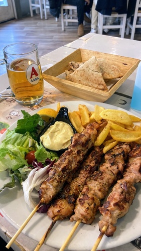 Chicken souvlaki on a restaurant plate 