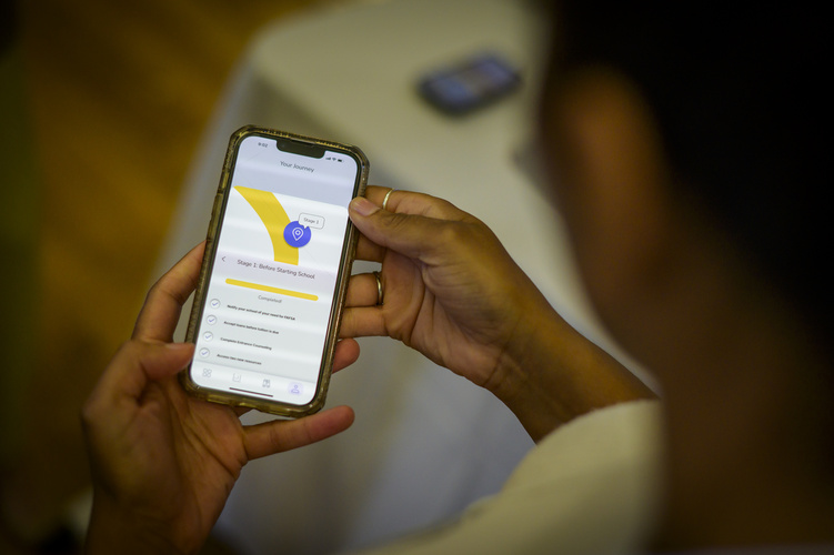A phone screen displays an app prototype.