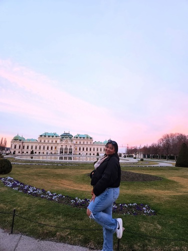 Yessenia poses in front of Große Bassin in Vienna, Austria.