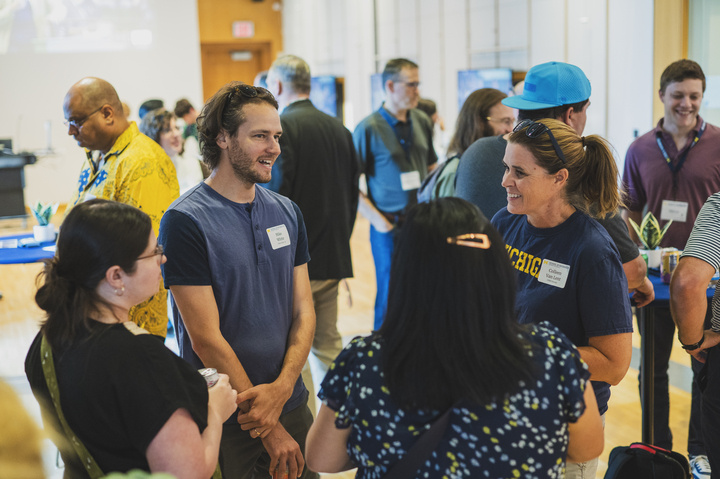 UMSI faculty and alumni reconnect at the homecoming reception.