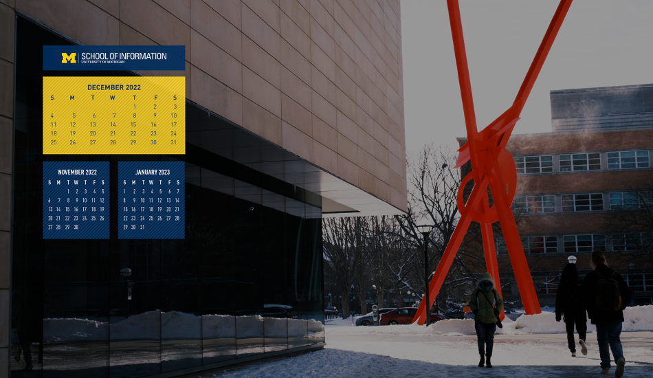 A maize and blue calendar for December 2022 on a photo background. There are two smaller calendars for November 2022 and January 2023 below it. The photo shows the north side of the University of Michigan Museum of Art building in the snow. Students are walking past in winter gear and a 50 foot tall red abstract sculpture stands outside of the museum.