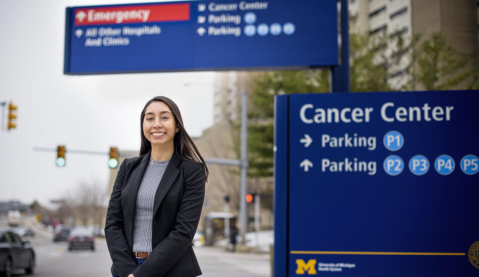 Alexis Villafranca standing in front of Michigan Medicine