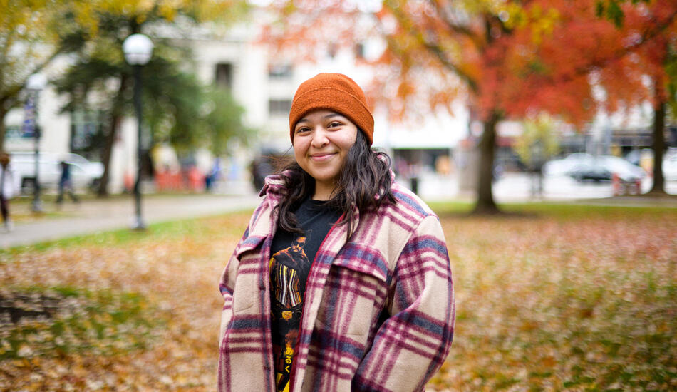 Zochil stands on the diag among colorful fall trees.