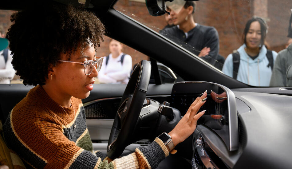 Sitting in the front seat of a car