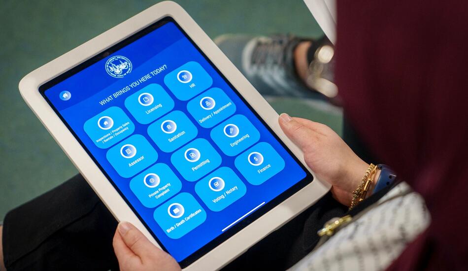 A close up view of a visitor management app on an iPad