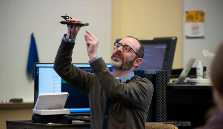 Jesse holds a floppy disk reader