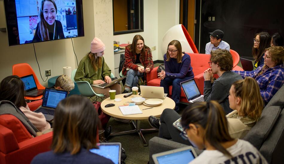 Students sit in a circle