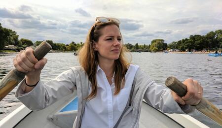 Stacey Beck canoeing and looking into the distance