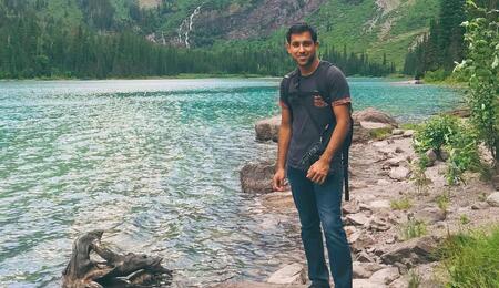 Ani Madurkar standing by river