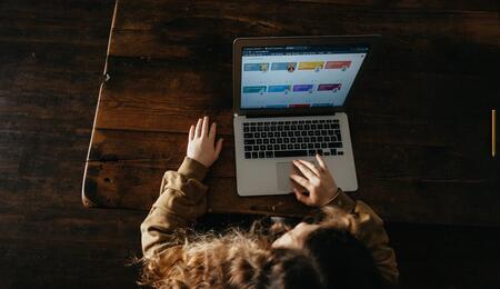 Overhead shot of a young person using a computer