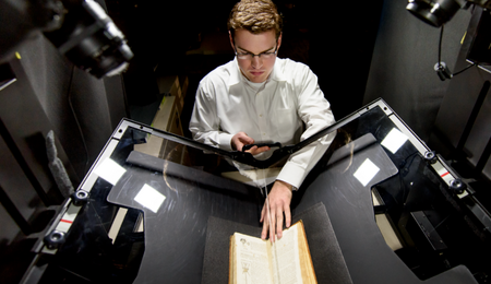 A student using a book scanner