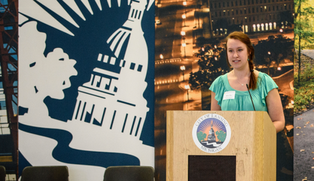 A student standing at a podium