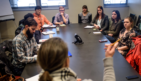 A group having a meeting at a conference table