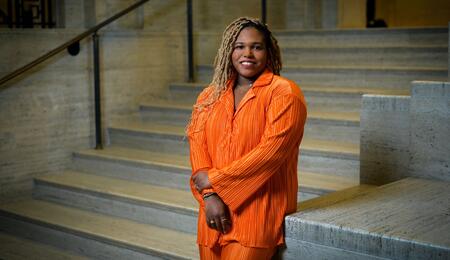 Chelsea poses in Rackham wearing orange