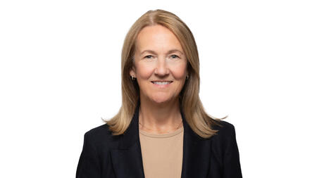 A professional headshot of Stephanie Teasley wearing a black blazer and smiling at the camera. She has blonde hair. 