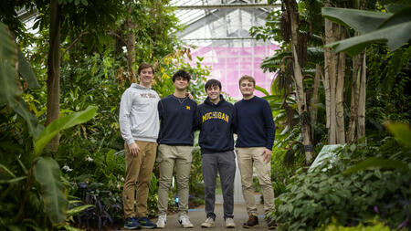 A photo of a SO-ELL program team standing inside the Matthaei Bottanical Gardens conservatory.