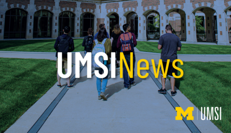 UMSI News. Students walking towards a building on UM's campus.