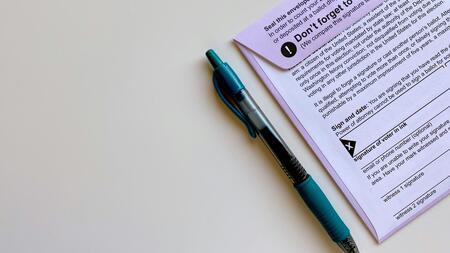 A stock image of a ballot and pen