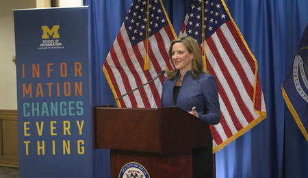Secretary of State Jocelyn Benson speaks at a podium