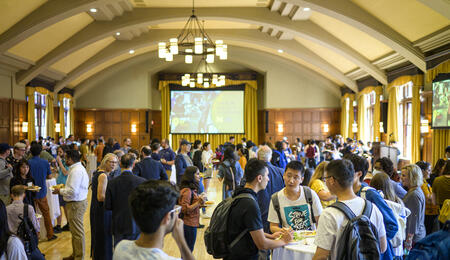 Students networking in a ballroom.