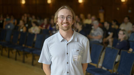 Mark Holmgren poses in the Michigan League during a presentation.